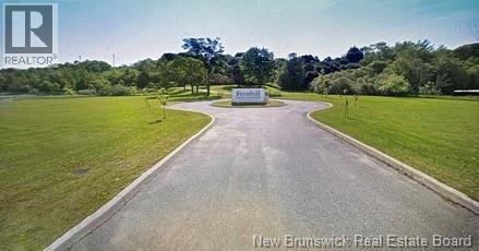Paved driveway with circular turnabout.