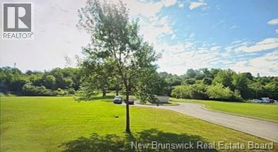 Beautifully manicured with mature trees.