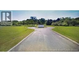 Paved driveway with circular turnabout.
