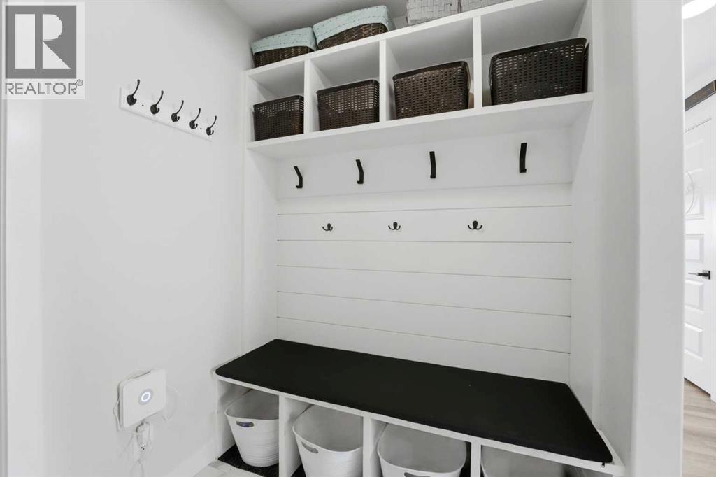 A practical boot room with built-in lockers and bench just off garage door