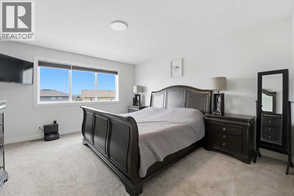 The spacious primary bedroom suite