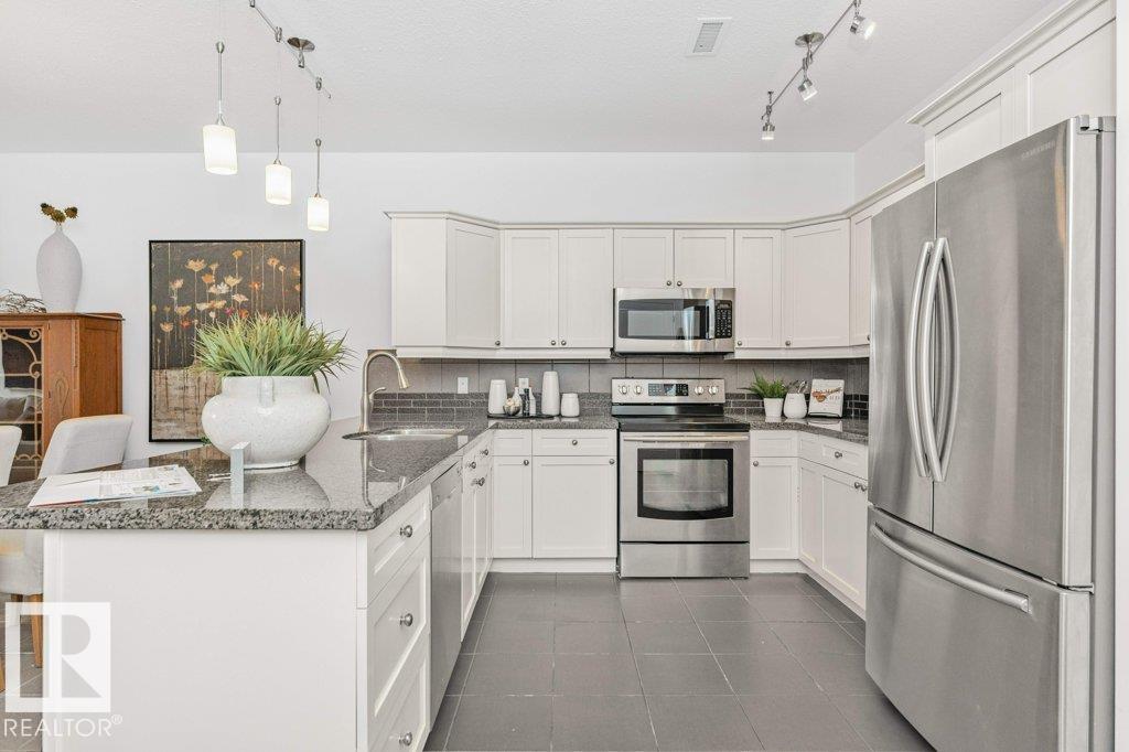 #302 160 MAGRATH RD NW - 17