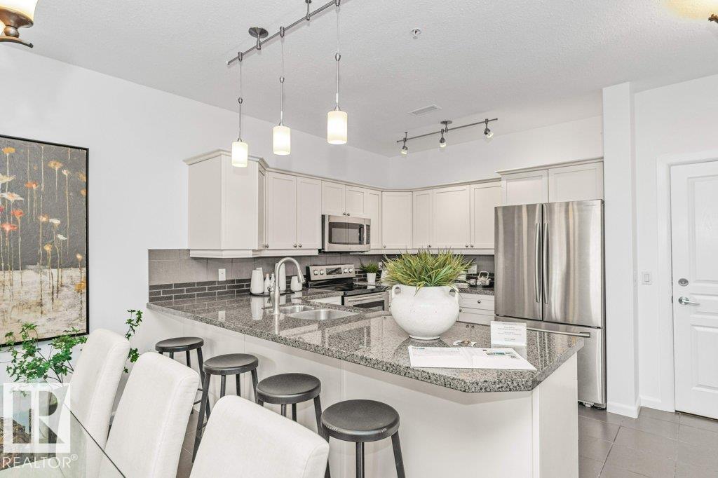 #302 160 MAGRATH RD NW - 18