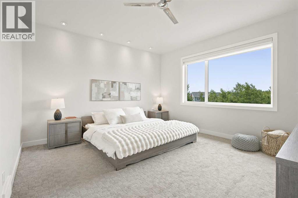 Primary bedroom with vaulted ceilings
