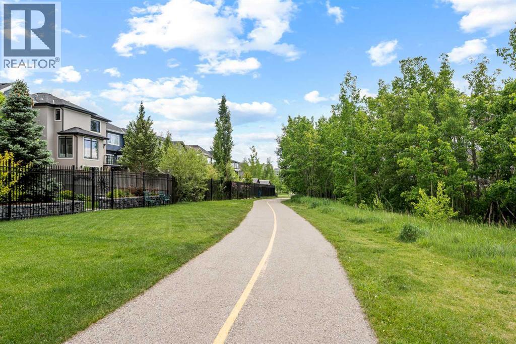 Trees, greenspace and walking paths behind the house