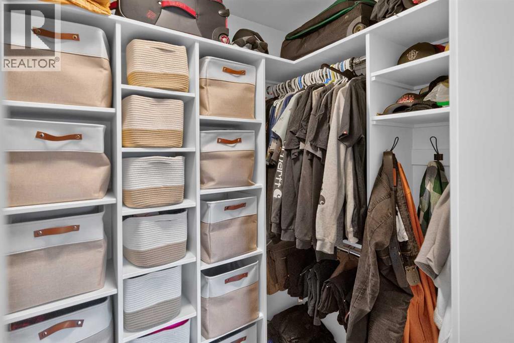 Primary bedroom walk in closet