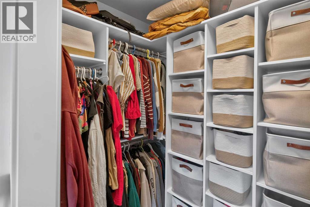 Primary bedroom walk in closet