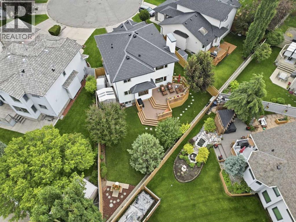 LARGE PIE SHAPED YARD  - features some mature trees and a spacious two tier deck - meticulously maintained