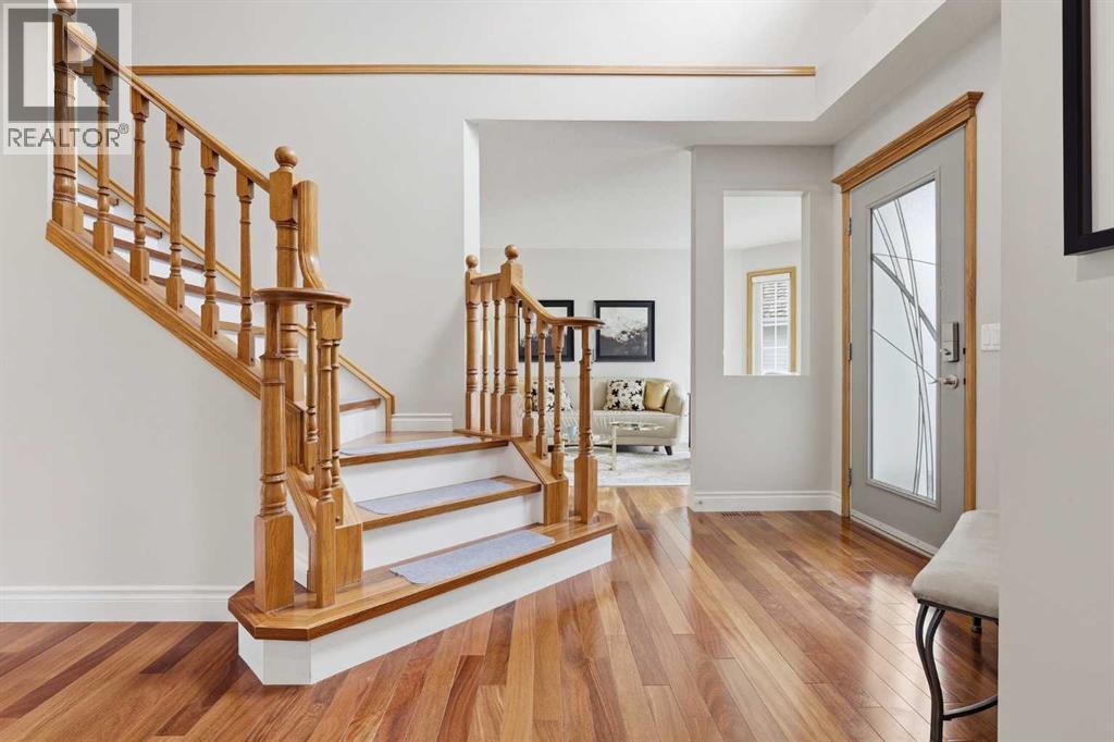 BRAZILIAN CHERRY HARDWOOD  - throughout the main living areas plus the stairs and upper floor halls. Pristinely kept oak handrails grace the staircase to the upper level