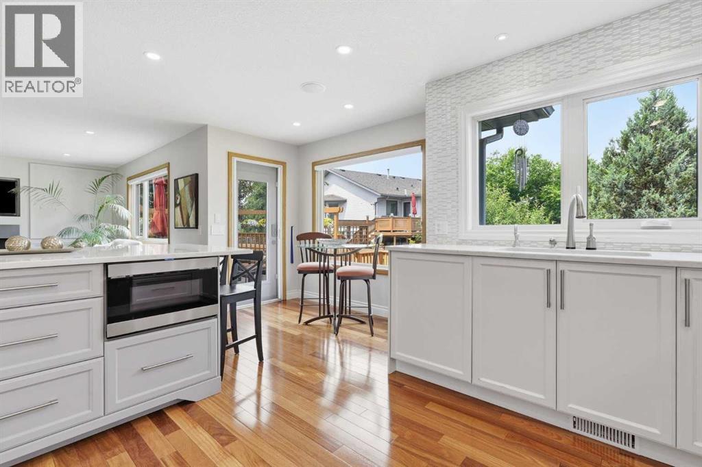 KITCHEN - A miele dishwasher is behind the last panel near the sink.. knock and it will open.. no hand prints anywhere.. a pull out full drawer microwave is easily accessible
