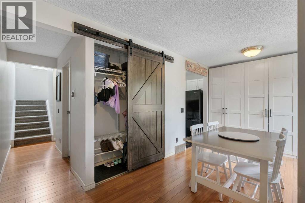 Dining room has custom built-in cabinetry that functions as a pantry