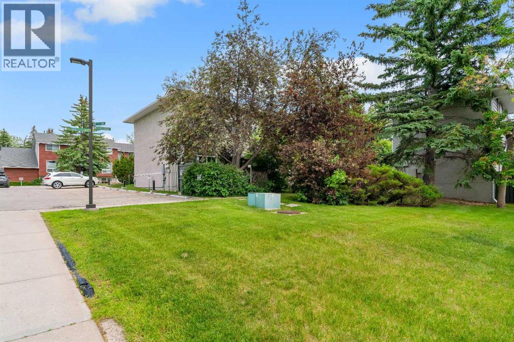 Patio opens onto a well-kept green space