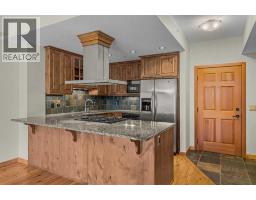 Primary Bedroom - 213, 505 Spring Creek Drive, Canmore, AB T1W0C5 Photo 9