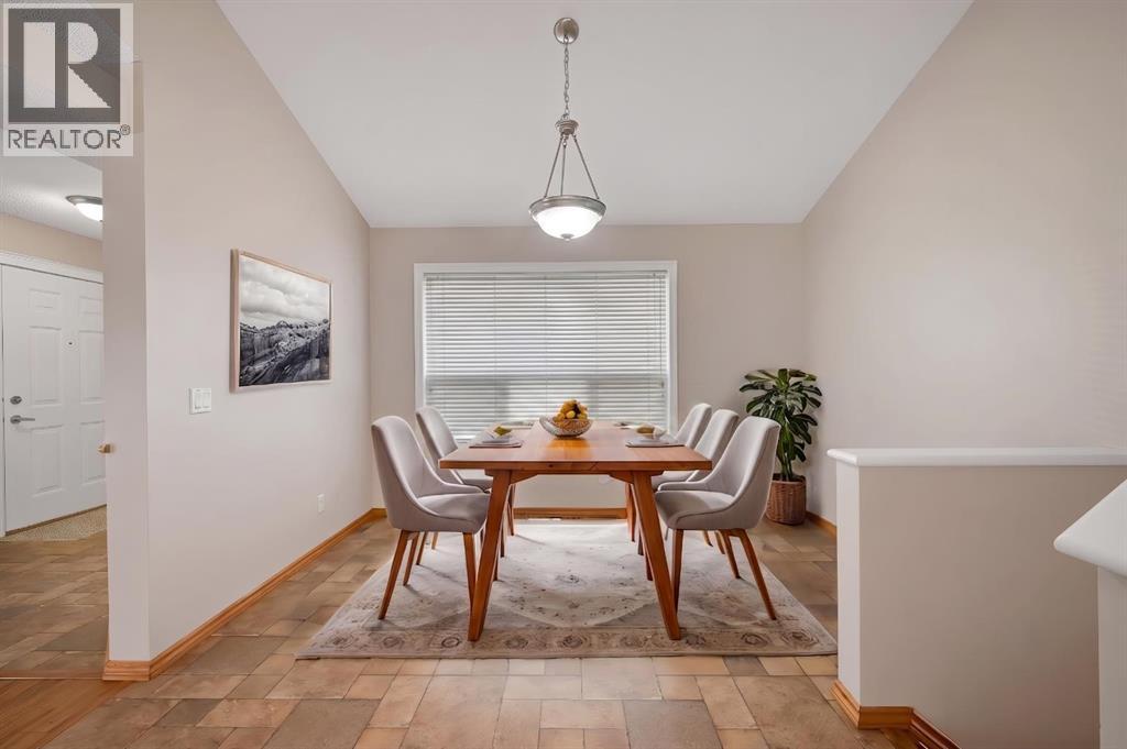 VIRTUAL Staging of the Dining Room shows just how much room there is for the table, chairs and even a buffet!
