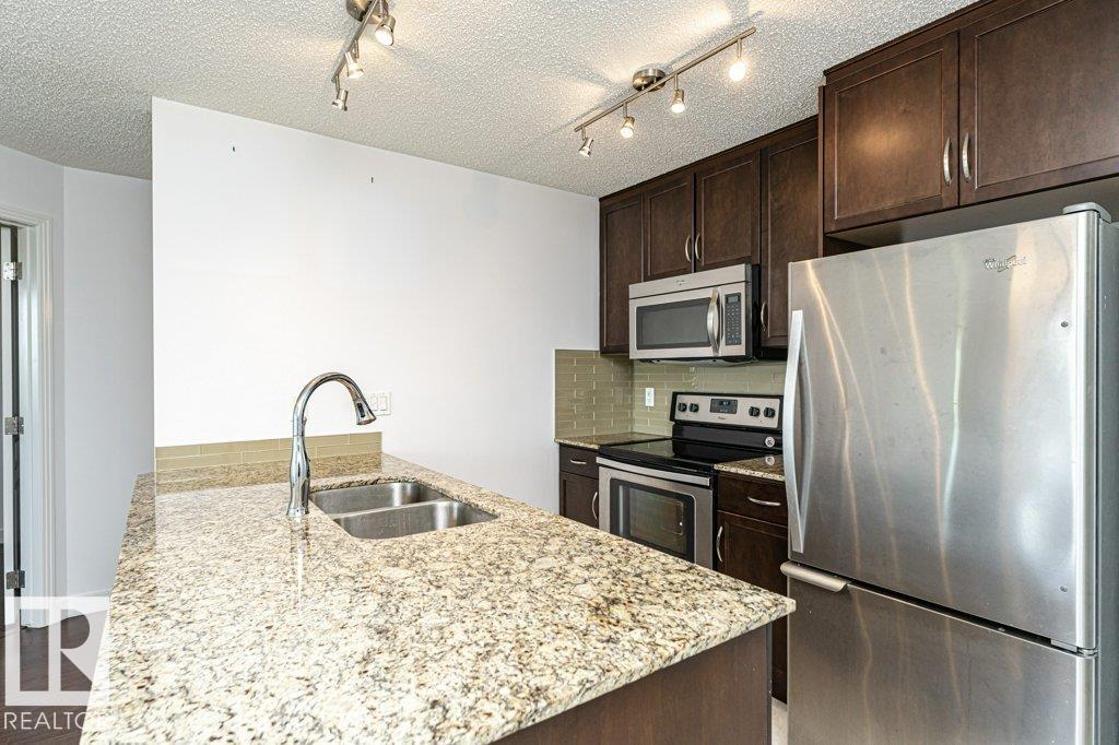 #207 7021 SOUTH TERWILLEGAR DR NW - 18