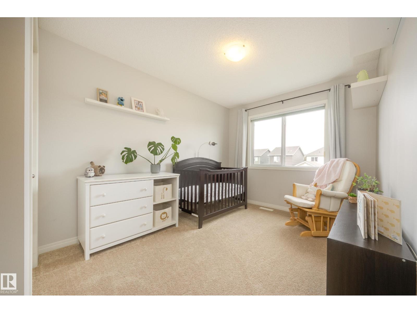 7987 ERASMUS CR NW — photo 24