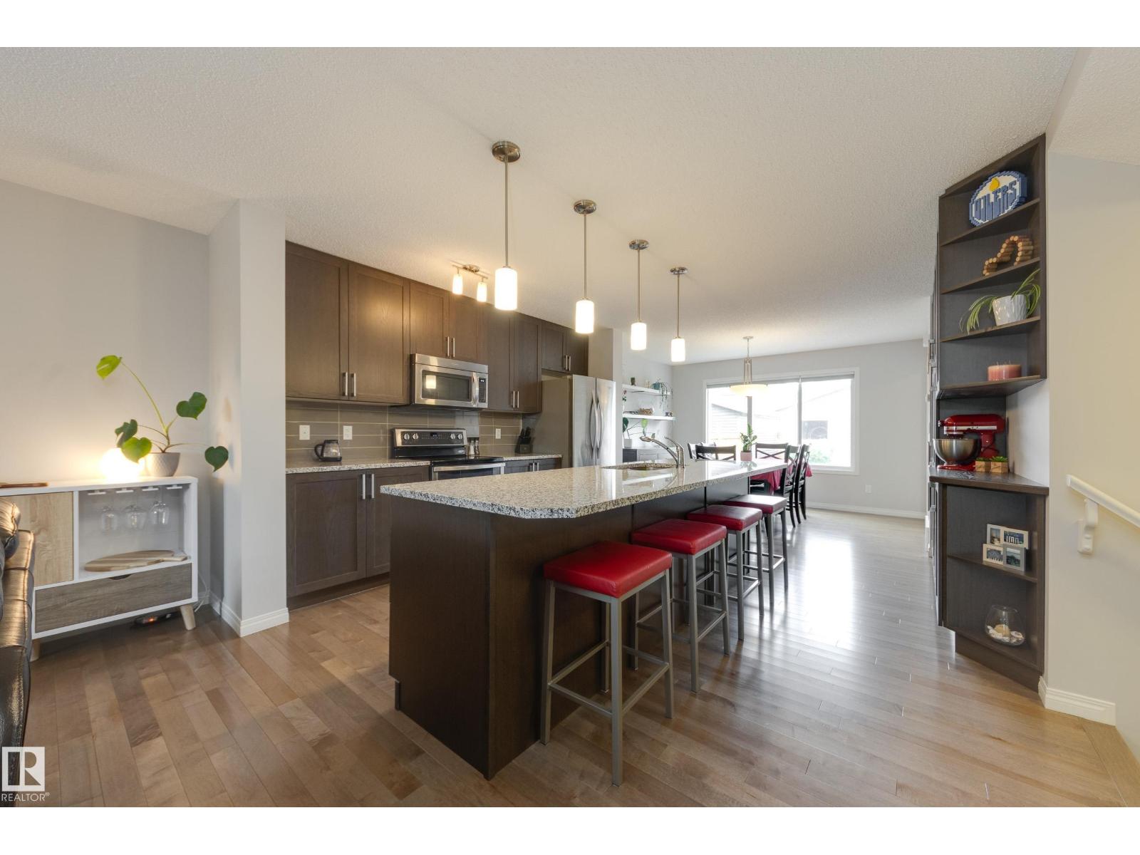 7987 ERASMUS CR NW - 8