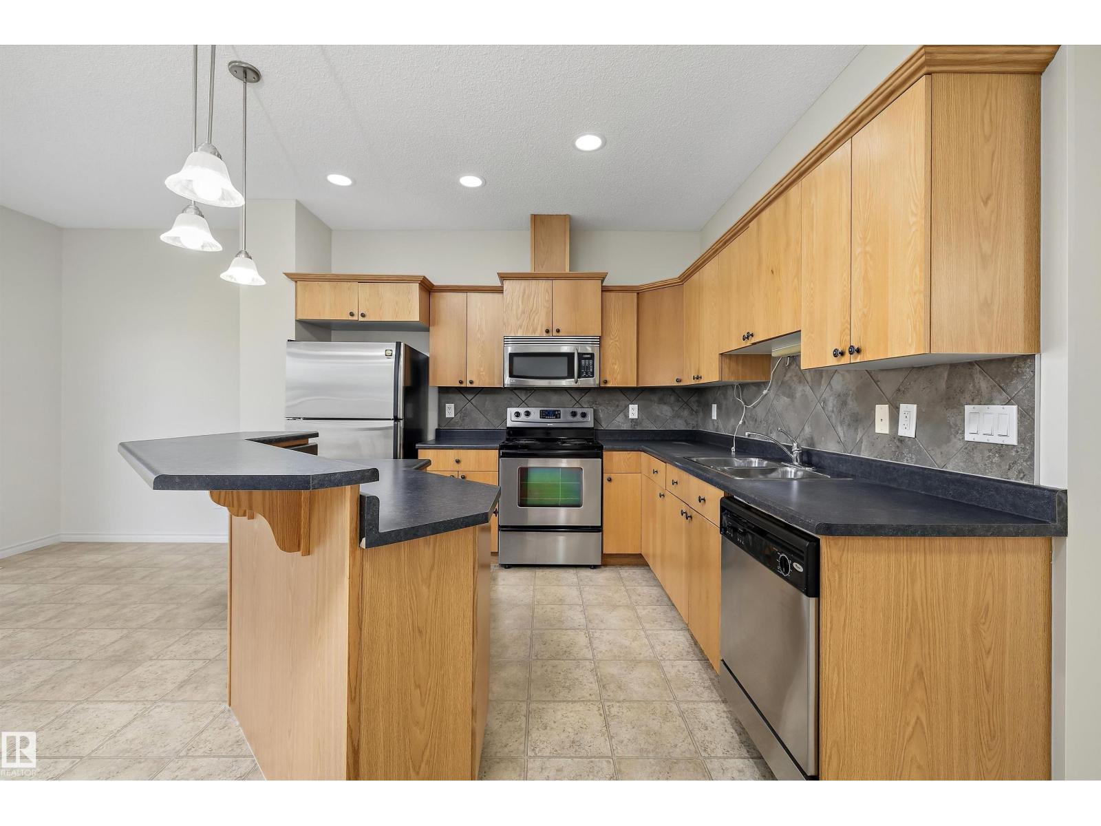 #101 13825 155 AV NW — photo 16