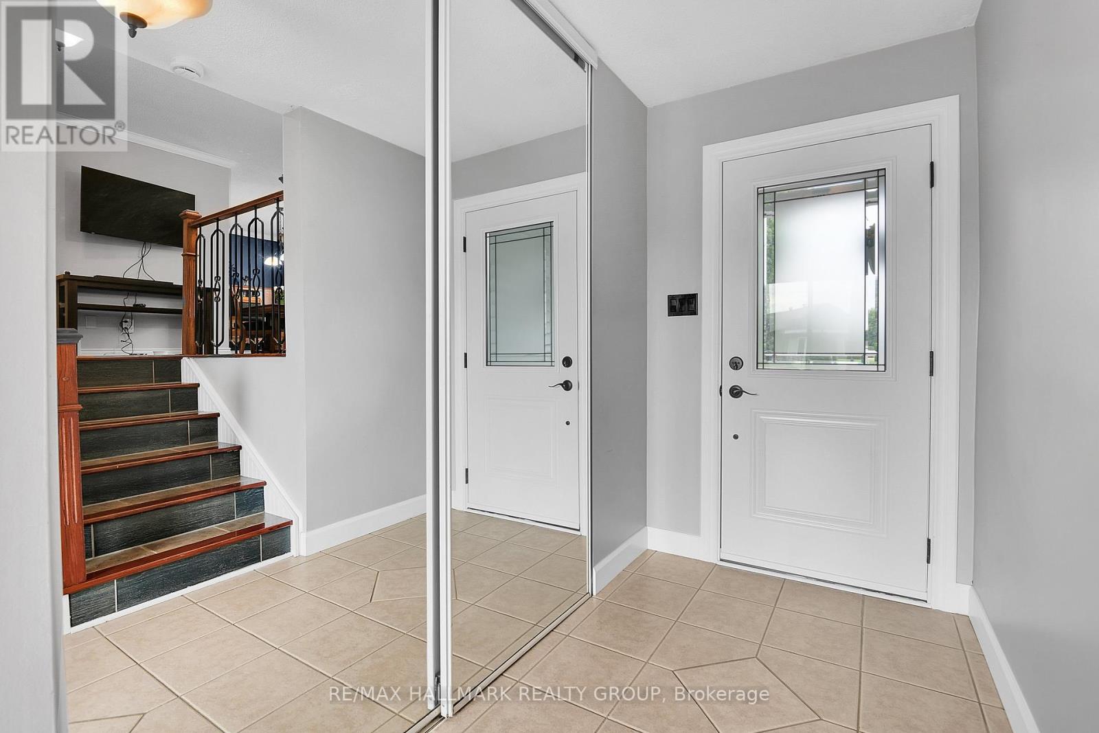 Bright Foyer with Access to Garage & Rear Yard