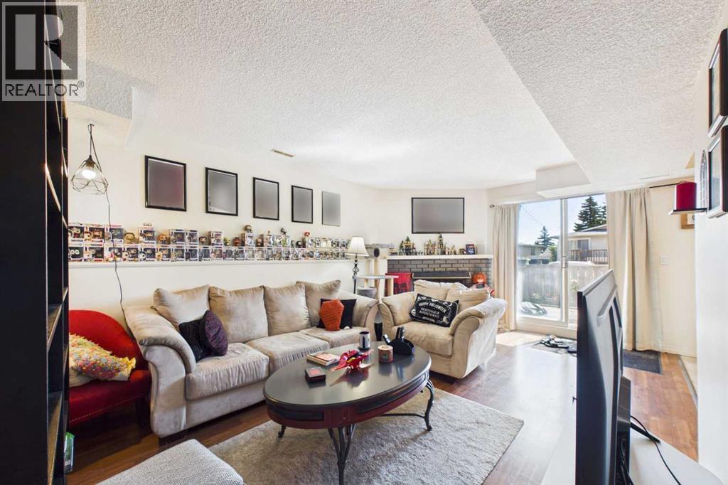 Living Room faces East to Interlocking Brick Patio with Vinyl Sliding Patio Doors
