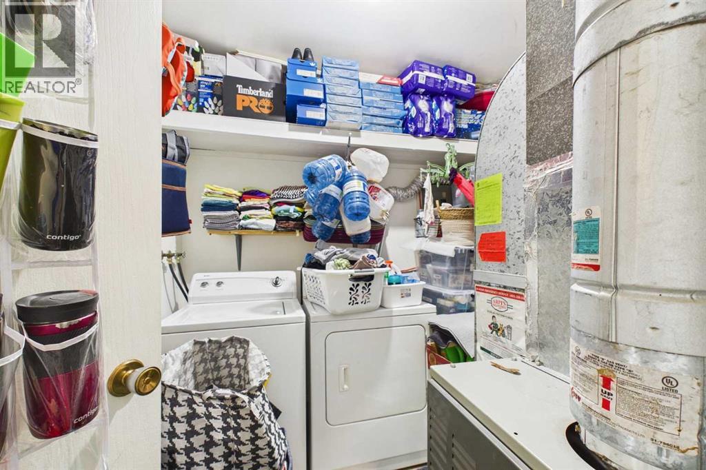 Mechanical, Utility & Laundry Room, 8'7"x10'1", Trane Furnace, Rheem Hot Water Tank, Kenmore Washer, Whirlpool Dryer, Storage Shelves, Tile Floor
