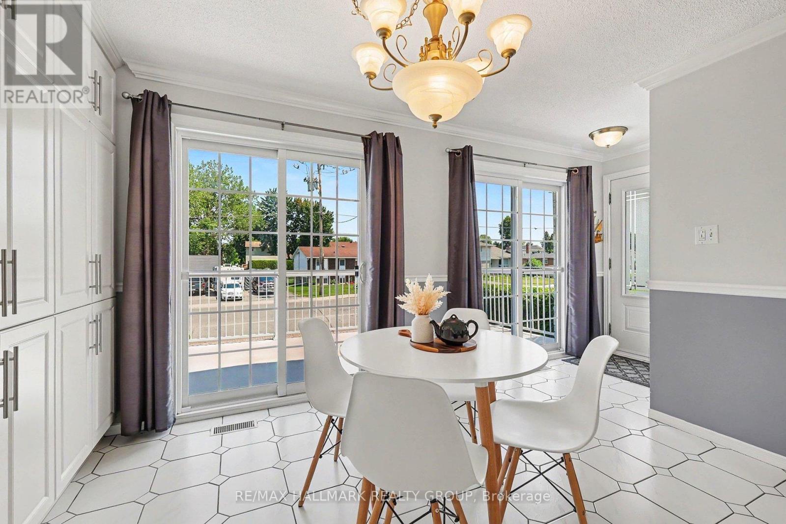 Kitchen overlooks front deck, patio door access