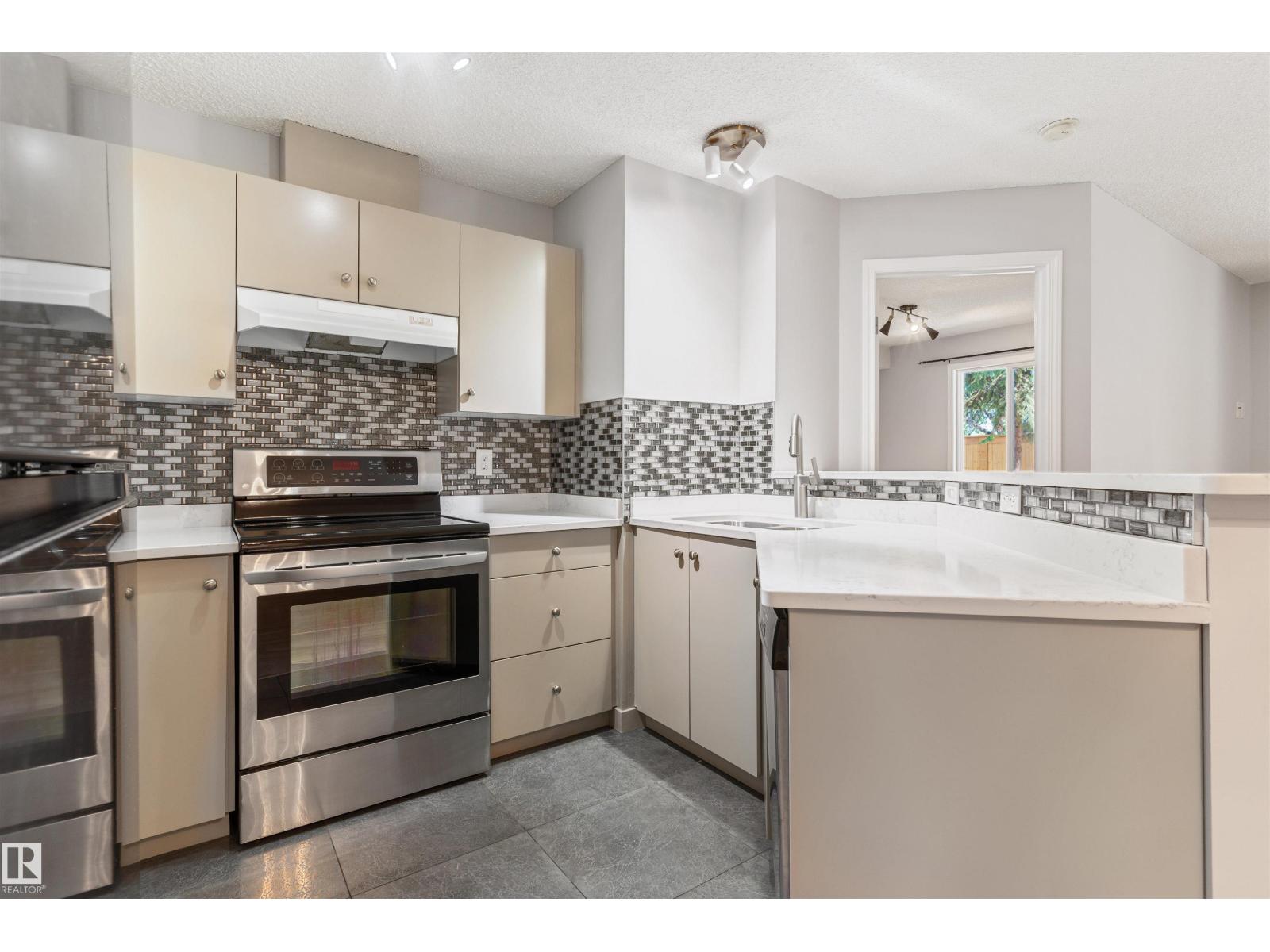 #112 11214 80 ST NW - 10