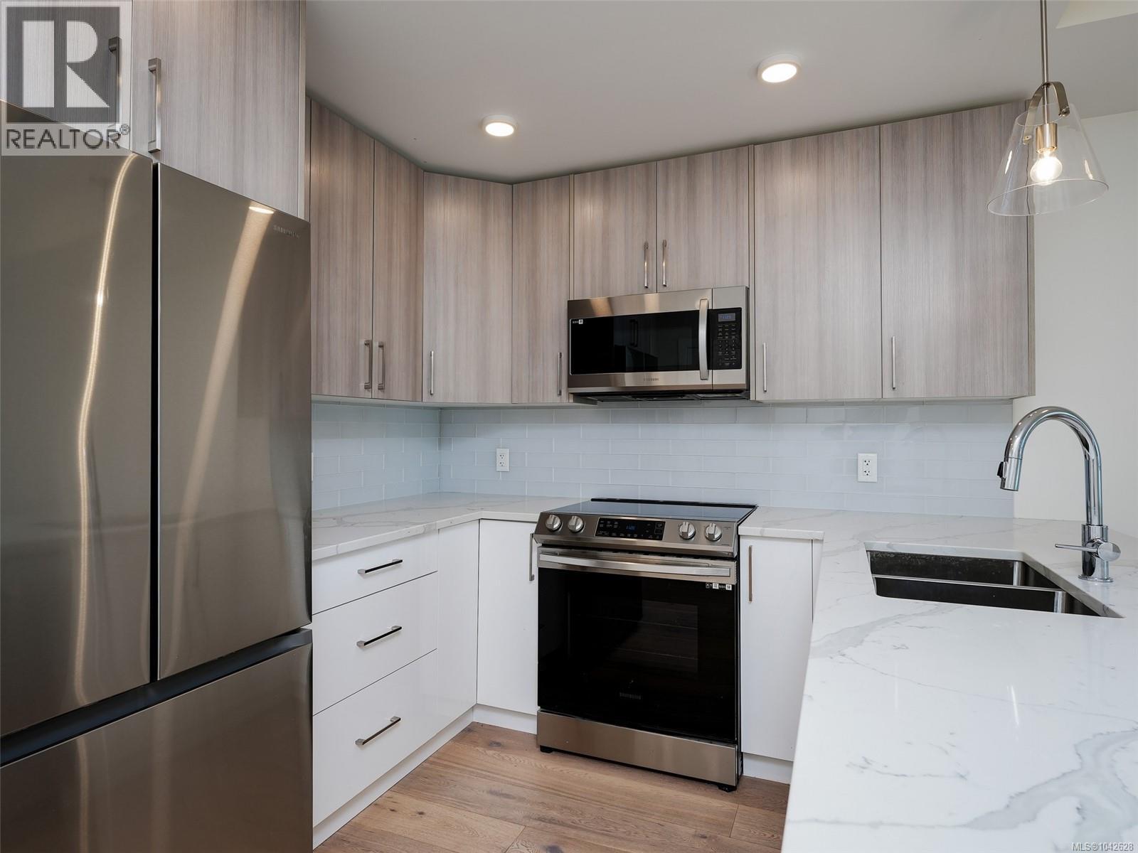 #203 7098 Wallace Dr - 6