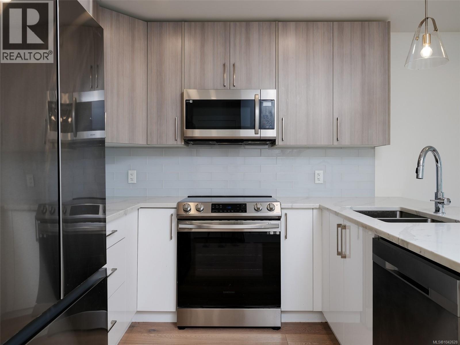 #203 7098 Wallace Dr - 7