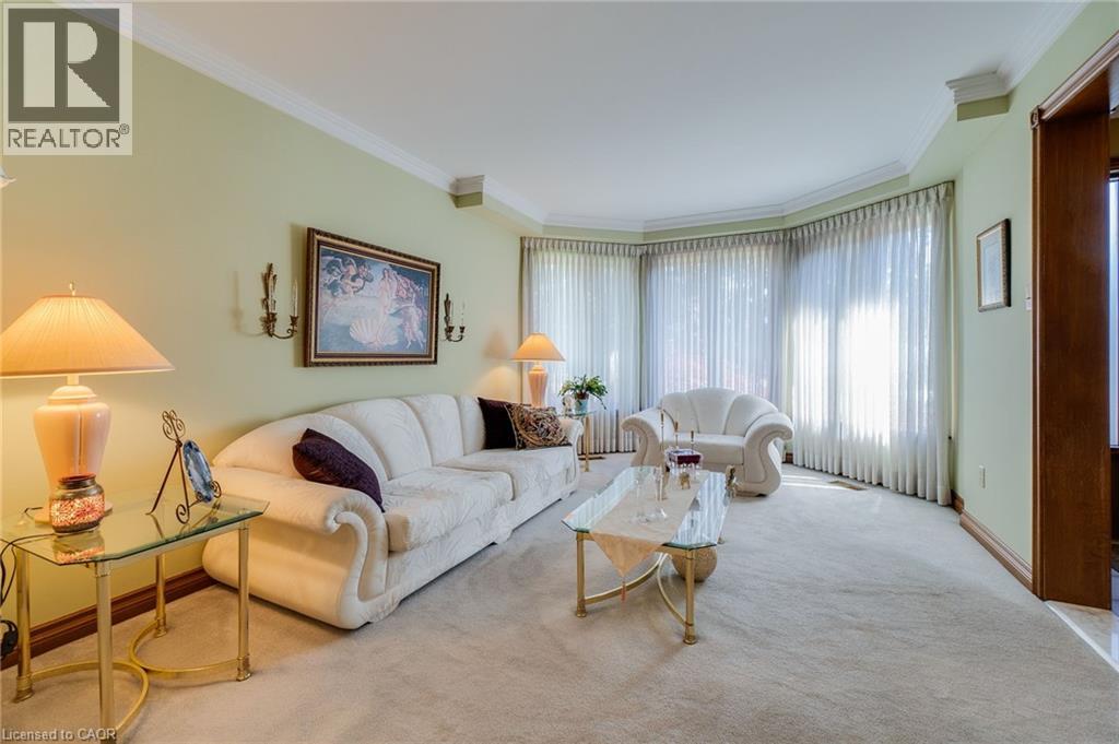 Combined living/dining room, large bay windows, broadloom, crown mouldings.
