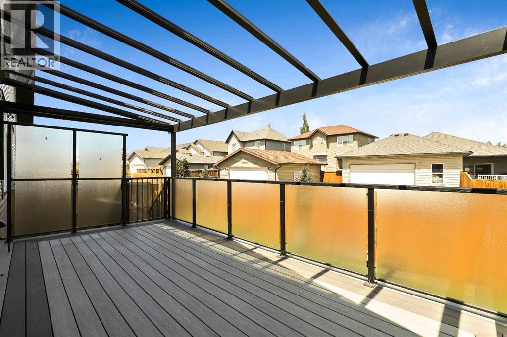 Covered back deck with remote controlled blinds on either end