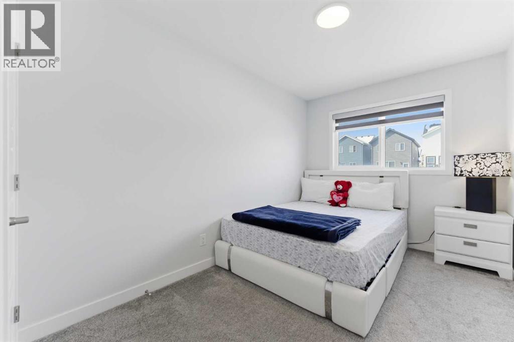 One of the three bedrooms located on the upper level..