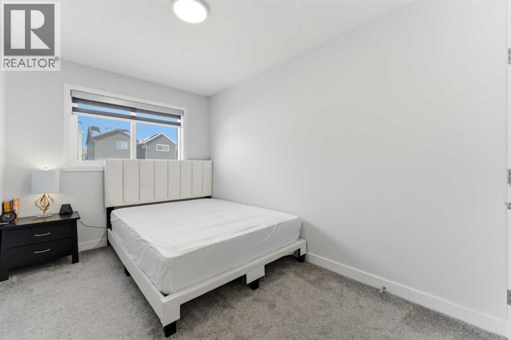 One of the three bedrooms located on the upper level..