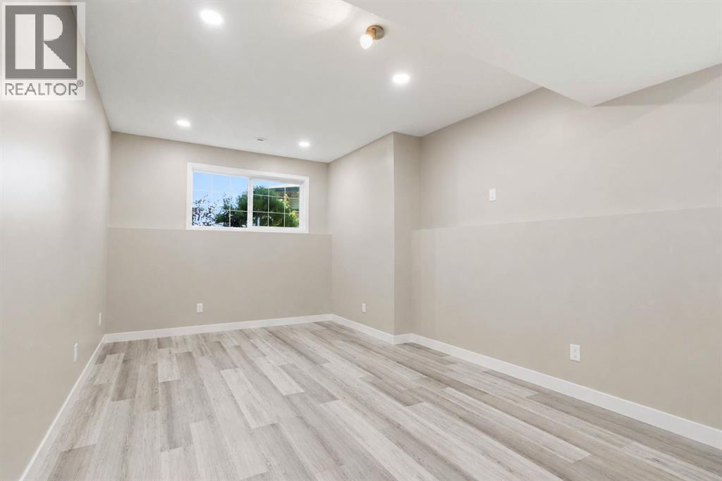 Spacious rec room with large above ground windows **Photo Edited