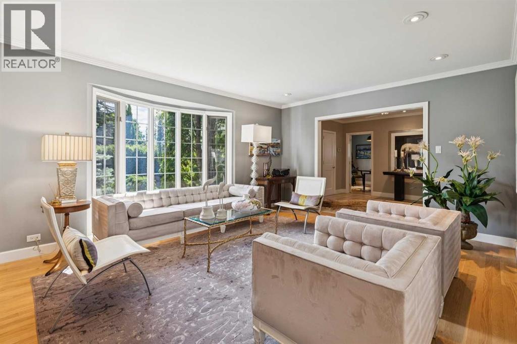 Flat painted ceilings, site-finished oak hardwood throughout + bright Interiors!