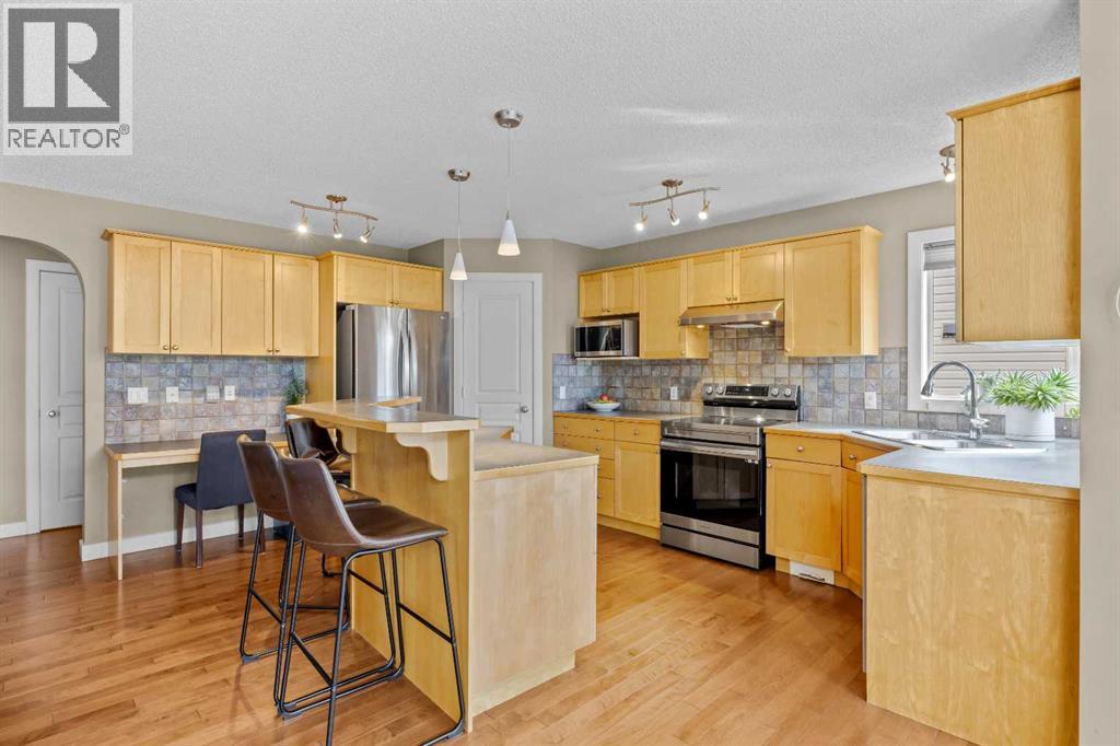 There's real function packed in here: a corner pantry, a built-in desk for homework or meal planning, and enough counter space to have more than one cook in the kitchen