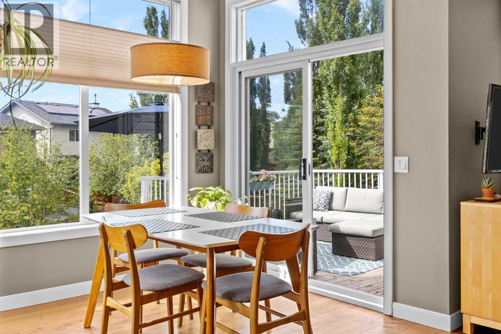 A sliding door opens straight onto the upper deck, so dinner drifts outside the moment the weather says yes
