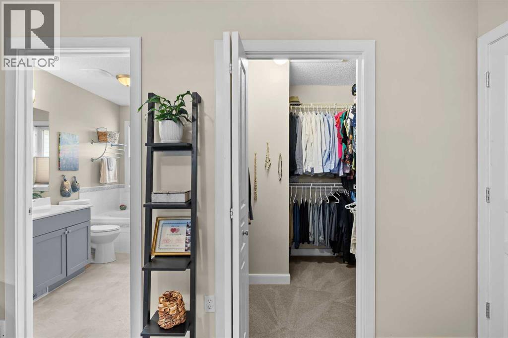The retreat continues with a walk-in closet and a 4-piece ensuite — his-and-hers hanging space on one side, a soaker tub waiting on the other