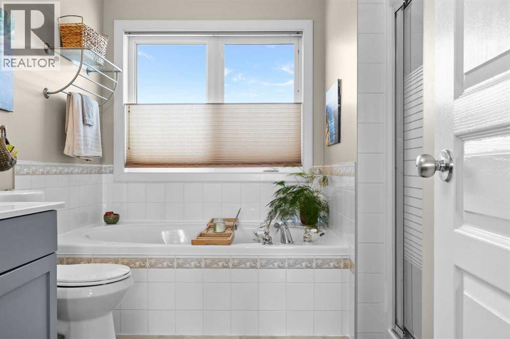 Candle lit, book open, door closed — this tub is where long weeks come to an end