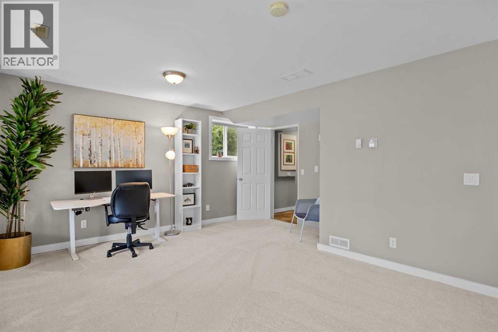The walkout basement is built for the life that happens when everyone comes over — a generous rec room with fresh carpet (2026), big bright windows, and direct access to the backyard