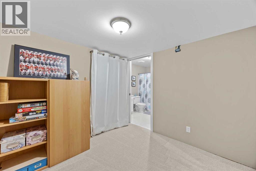 Tucked beside a full bathroom, this space adapts easily for guests, teens, or extended stays