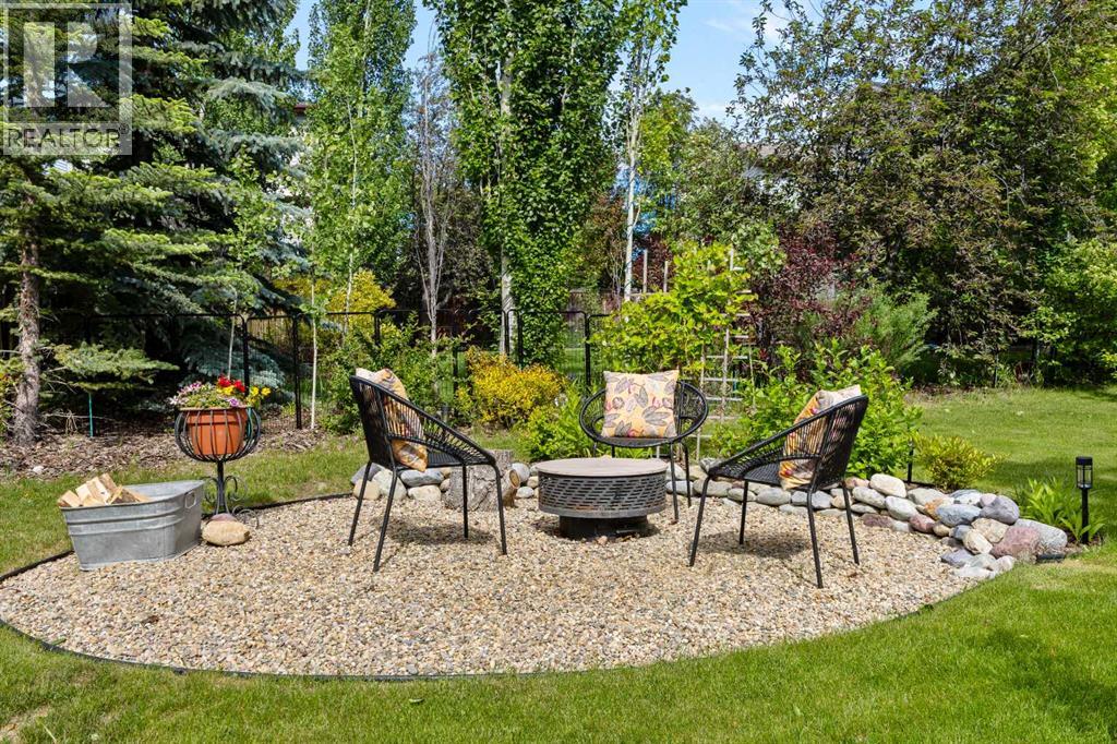 The dedicated firepit area is where summer nights stretch out — s'mores, stories, and stars over one of Tuscany's most beautiful backyards