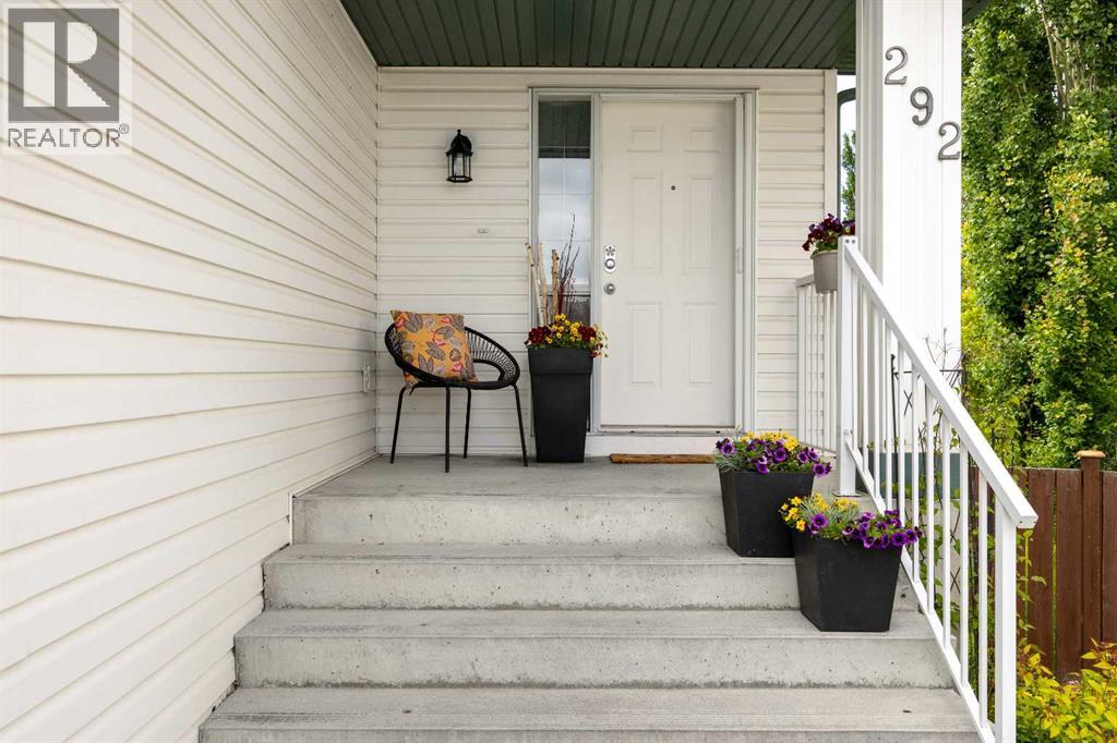 The covered front entry welcomes you home — and puts Tuscany School, St. Basil, and Senator Patrick Burns all within walking distance of this doorstep