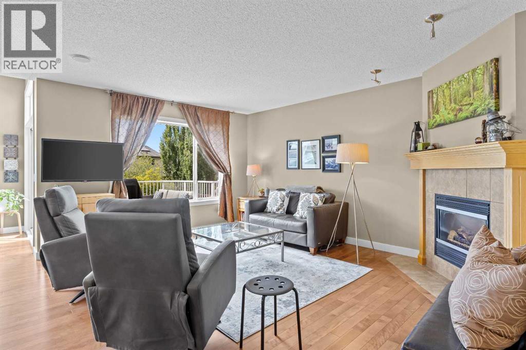 Large windows pull the backyard greenery right into the room, so even movie night comes with a view