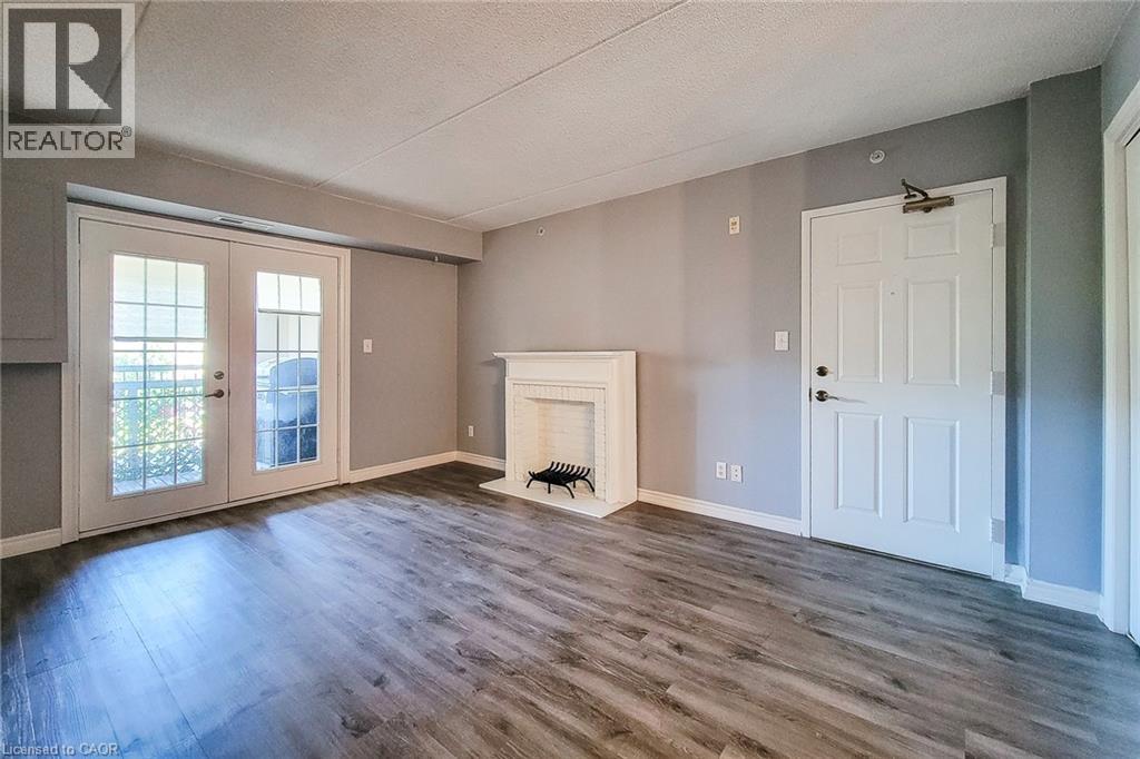 Living space featuring wood-finish flooring and neutral wall tones