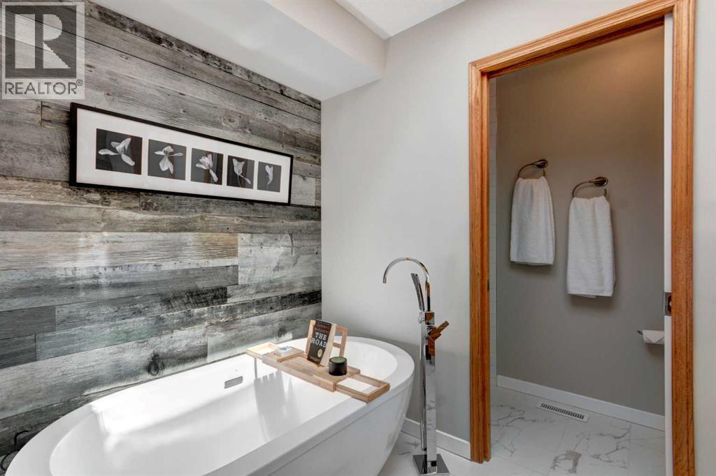 Beautiful stand alone bathtub sits under the skylight ~