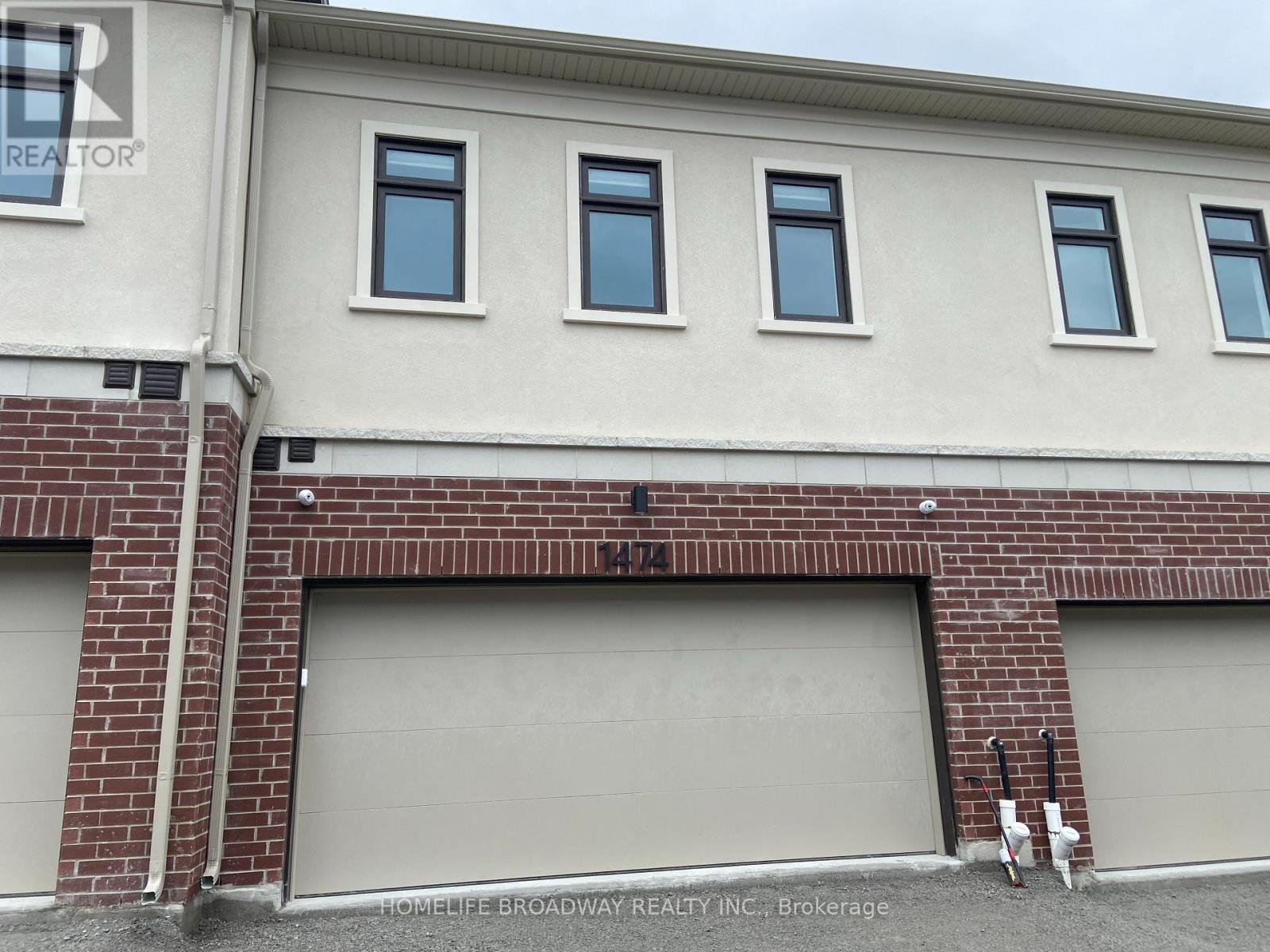 back of the house with double garage