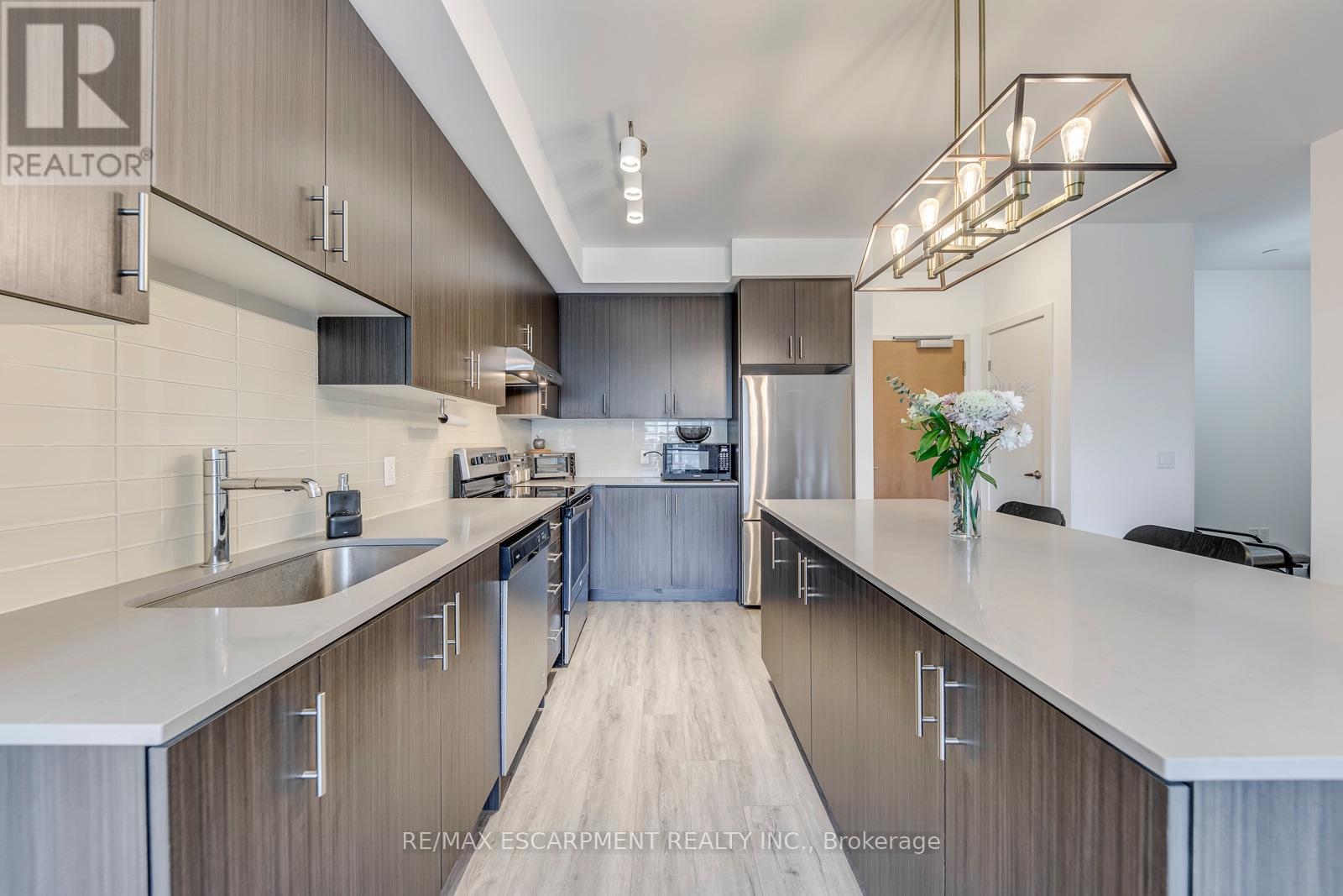 #303 320 PLAINS ROAD E - 18
