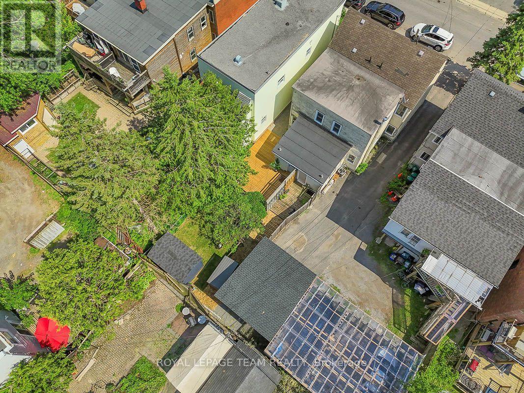 Back arial shot showing the house and backyard