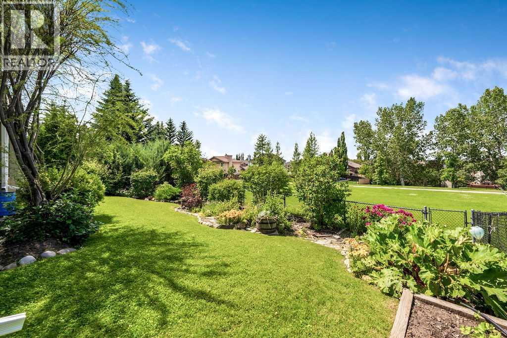 Landscaped Backyard with Gate to Greenspace